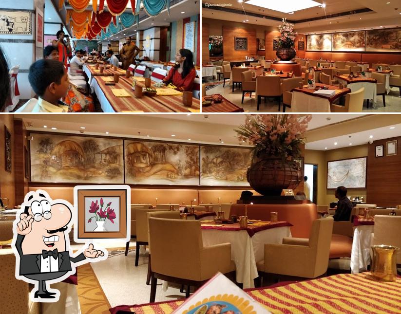 Take a seat at one of the tables at Aaheli