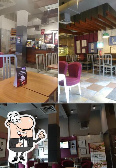 Take a seat at one of the tables at Café Coffee Day