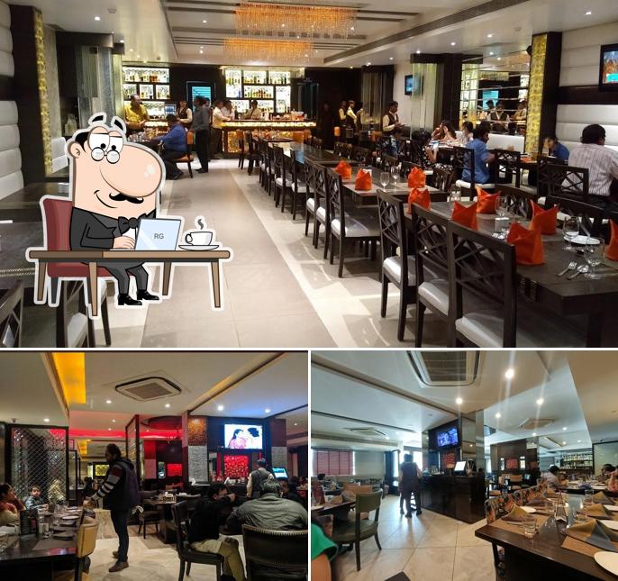 Take a seat at one of the tables at Pinch Of Spice