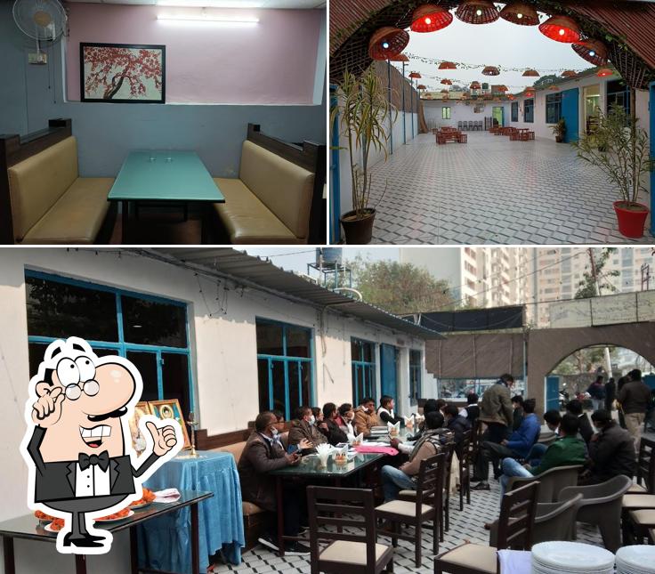 Take a seat at one of the tables at Fast Food