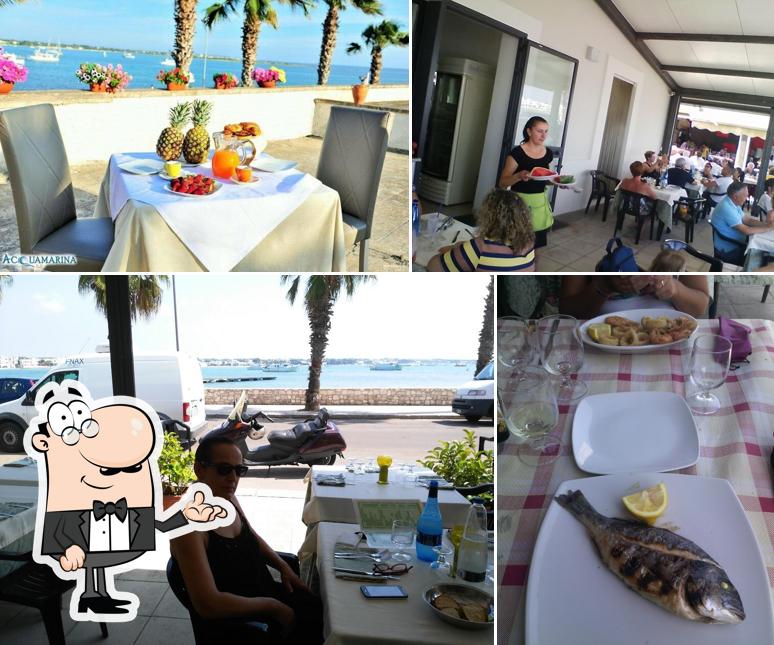 Guarda la foto che presenta la interni e tavolo da pranzo di Ristorante al Grottino