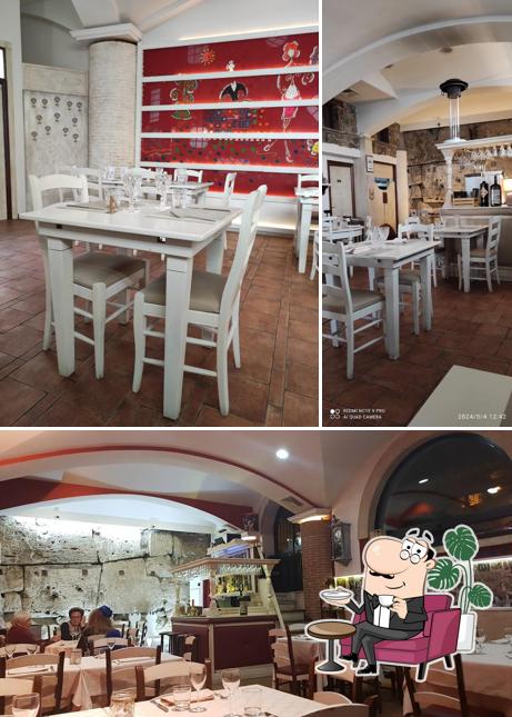 Siediti a un tavolo di Trattoria Antiche Mura