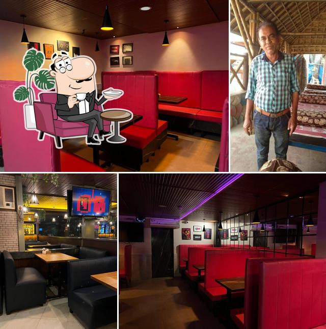 Take a seat at one of the tables at Maratha Kinara Restaurant