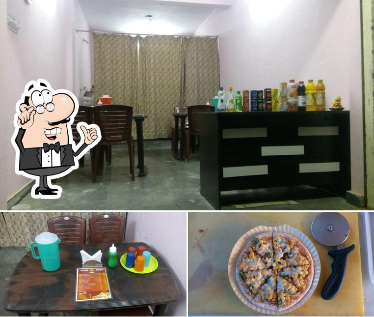 The picture of interior and food at Pizza Town Medchal