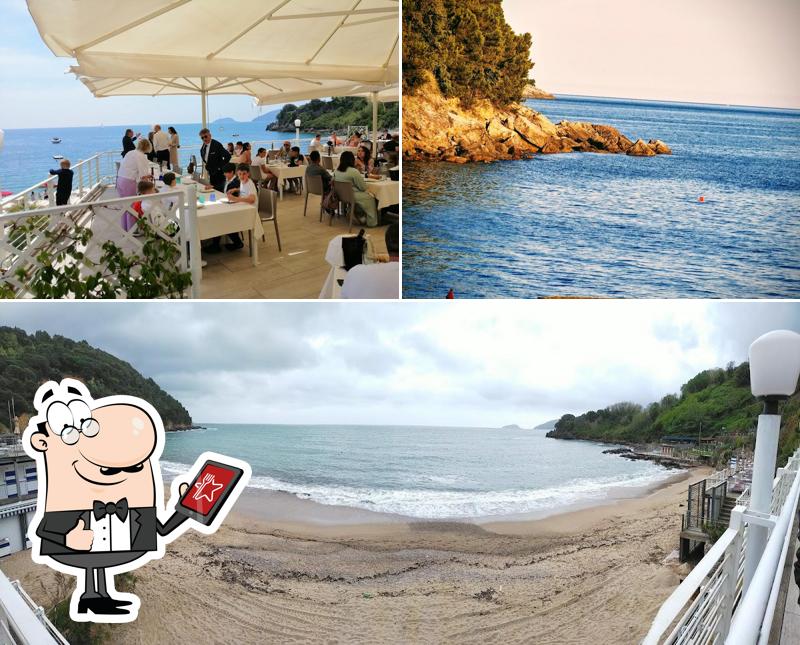 La immagine di esterno e tavolo da pranzo da Ristorante La Baia