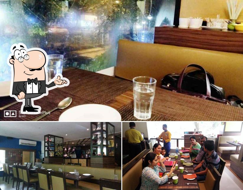 Take a seat at one of the tables at Bijoli Grill - Southern Avenue