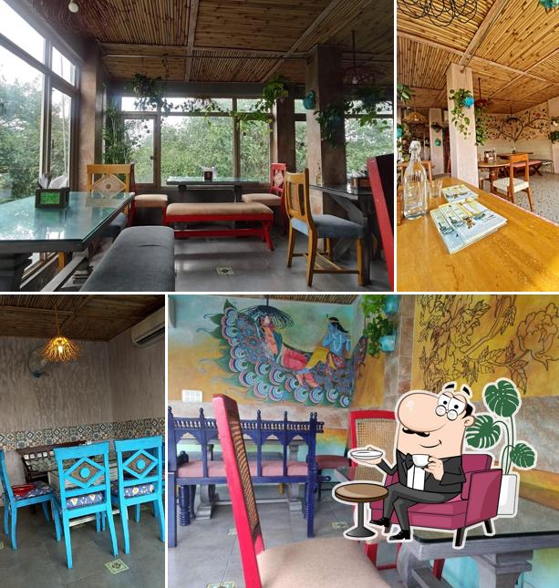 Take a seat at one of the tables at The Potbelly Rooftop Cafe