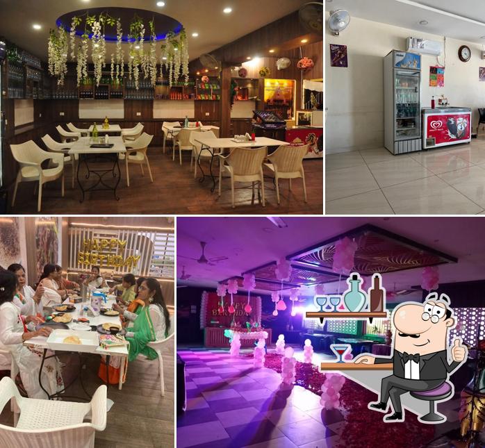 Take a seat at one of the tables at Madhuram restaurant