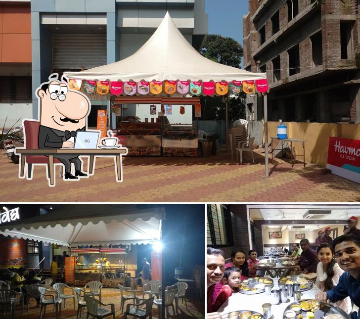 Take a seat at one of the tables at Hotel Naivedya Thali