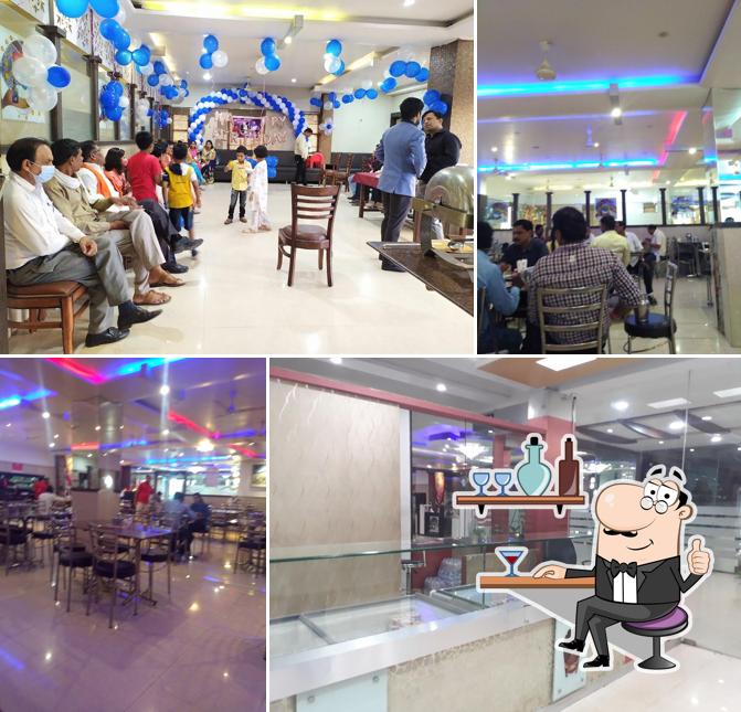 Take a seat at one of the tables at Rasoi Restaurant