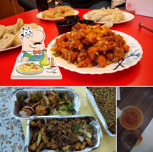 Take a look at the picture displaying food and beer at Momo Queen