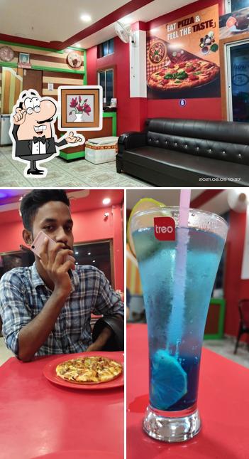 The picture of Pizza cafe Bijni’s interior and beer