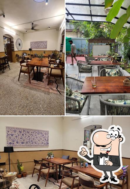 Take a seat at one of the tables at Mauji - The Time Cafe