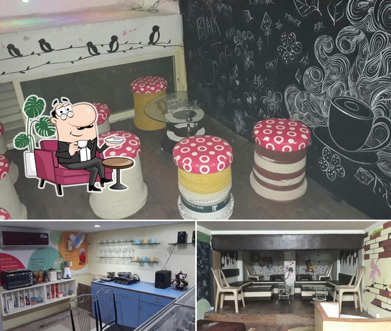 Take a seat at one of the tables at Tom & Jerry Cafe