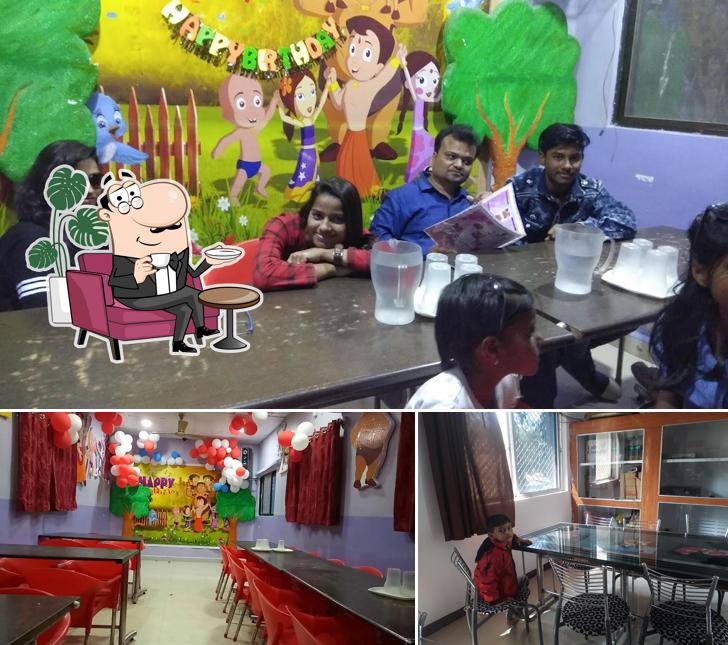 Take a seat at one of the tables at VARUN RESTAURANT