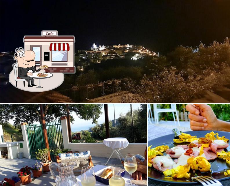 Puoi goderti l'aria fresca da seduto all'esterno di La Quercia Agriturismo Ristorazione