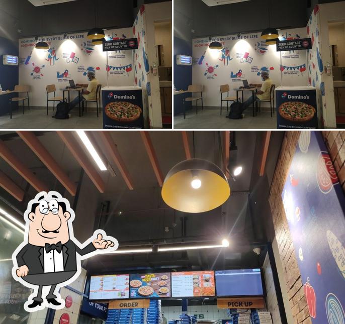 Take a seat at one of the tables at Domino's Pizza Sector 14, Panchkula