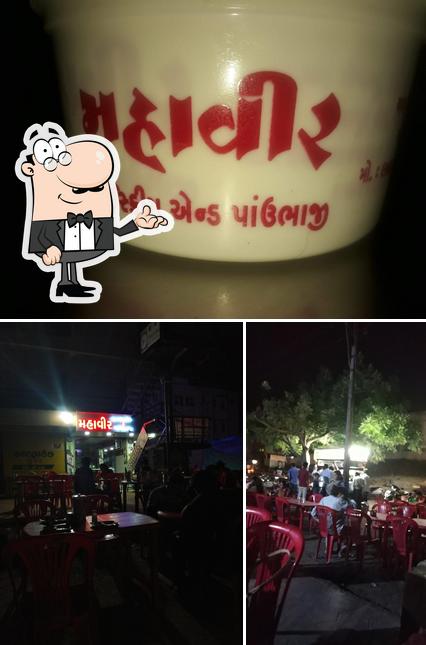 Take a look at the photo showing interior and food at Mahaveer PavBhaji