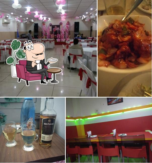 Take a seat at one of the tables at Silver Spoon Restaurant & Banquet Hall barnala