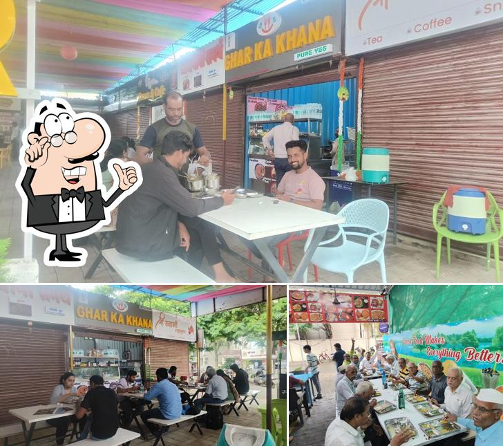 Take a seat at one of the tables at Ghar ka Khana