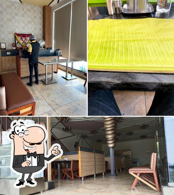 Take a seat at one of the tables at Hotel Sri Surya