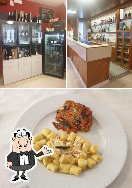 Questa è la immagine che raffigura la interni e cibo di Trattoria al Cavallino
