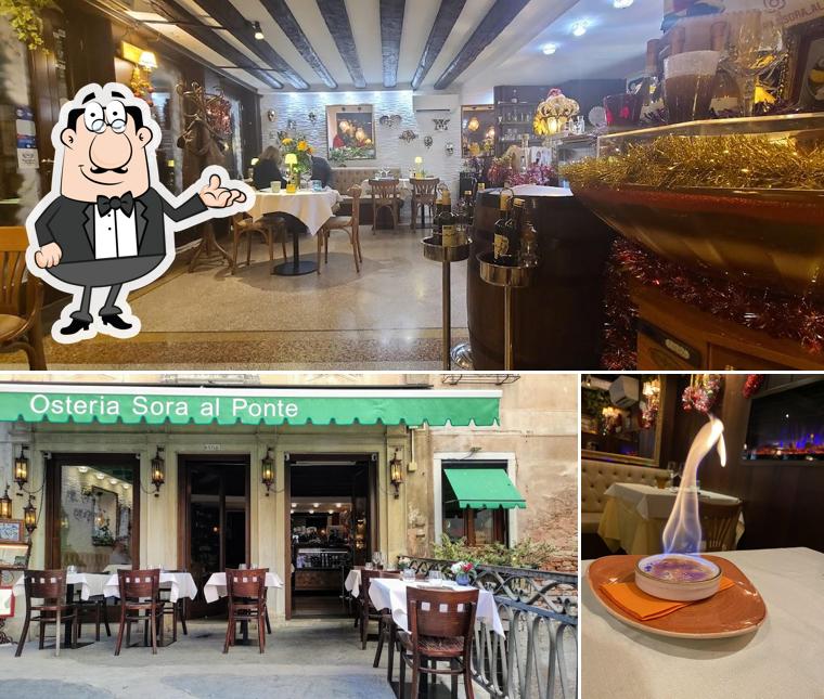 Questa è la foto che presenta la interni e tavolo da pranzo di Sora Al Ponte