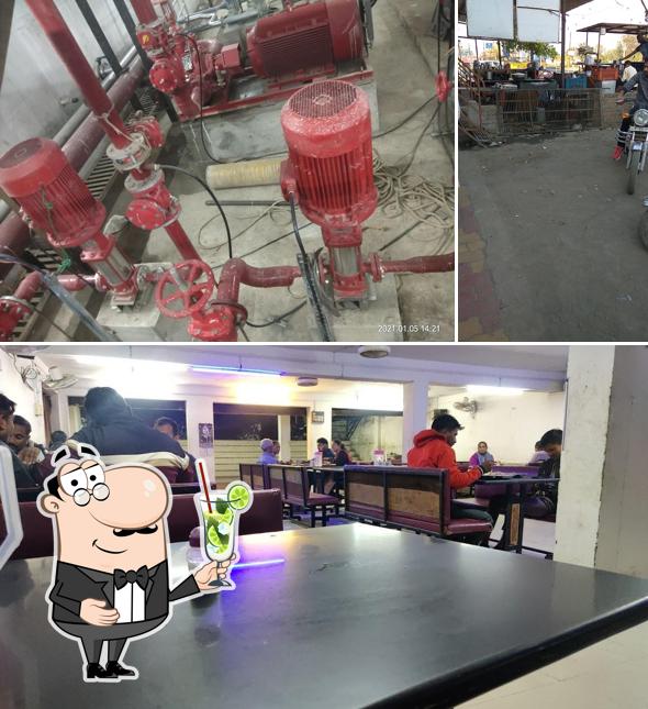 Enjoy a beverage at RK Bhajipao Corner.રાજુભાઇ