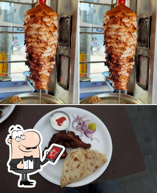 Check out the photo depicting exterior and food at Tasty Bites