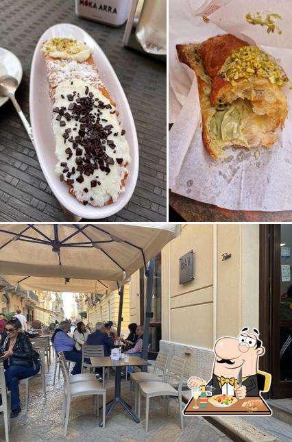 Tra le varie cose da Bar Nuova Birreria Italia si possono trovare la cibo e interni