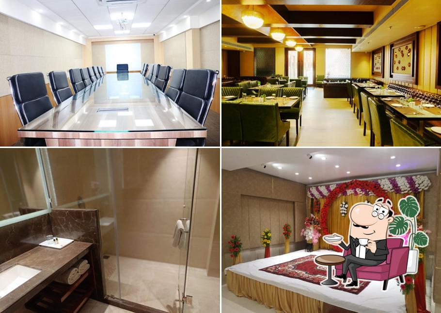 Take a seat at one of the tables at Grand Geet Hotels