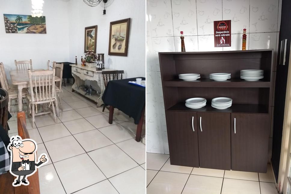 Sente em uma das mesas no Restaurante Forninho Kent