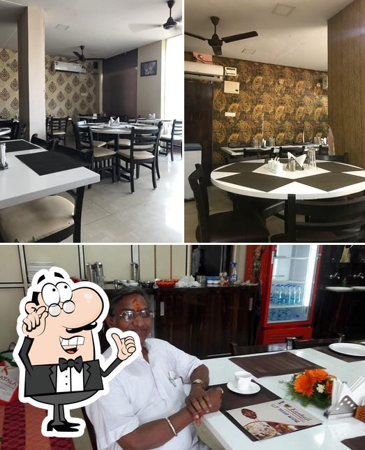 Take a seat at one of the tables at Kanhaji Restaurant, Visakhapatnam