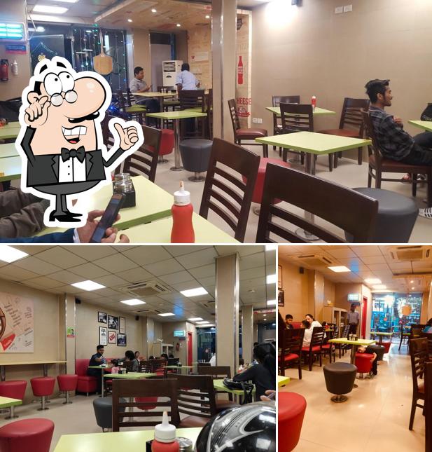 The interior of Domino's Pizza Beltola Tiniali, Guwahati