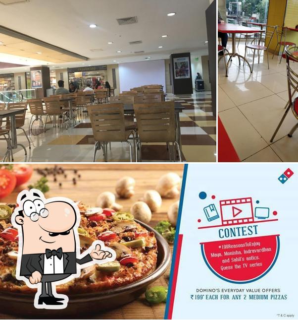 Take a seat at one of the tables at Domino's Pizza Manpada Thane West, Thane