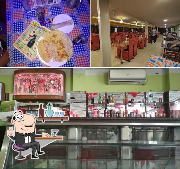 Take a seat at one of the tables at ANANDALOKE RESTAURANT