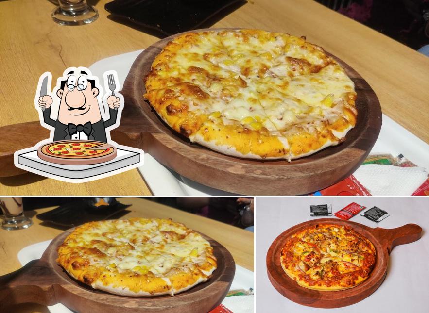 Try out pizza at The Cafe Club
