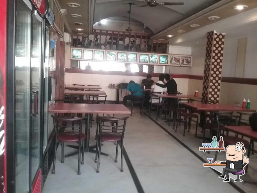 Take a seat at one of the tables at Baba Banwari Lal Restaurant