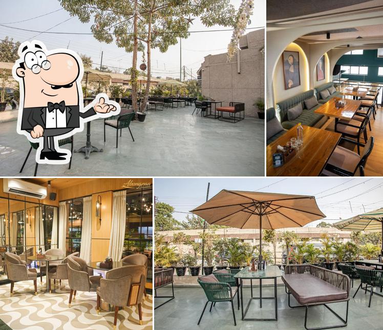 Take a seat at one of the tables at Abongzaa Multi Cuisine Cafe & Restaurant - Lucknow