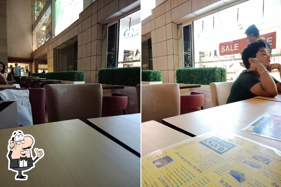 Take a seat at one of the tables at Coffee World