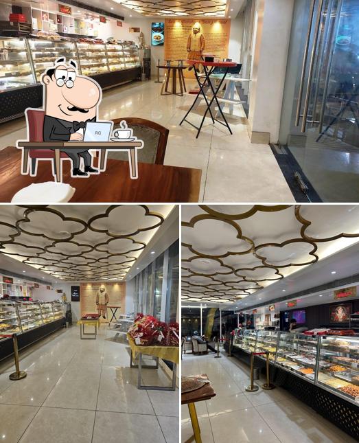 Take a seat at one of the tables at THE GHANSHYAM AMRITSAR MITHAIWALE - JALANDHAR