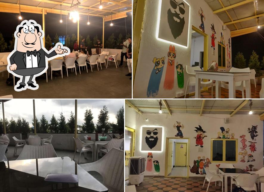 Take a seat at one of the tables at Uncle Johnny Cafe - Cafe in Koramangala