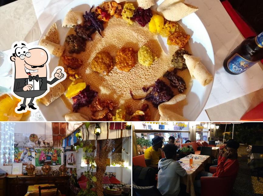 Questa è la immagine che presenta la interni e cibo di Addis Ristorante - Cucina Etnica - Etiope & Eritrea
