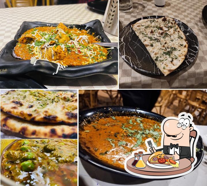 Get pizza at Shaukeens Restaurant and cafe