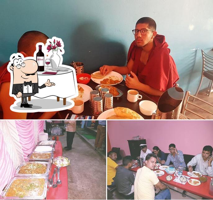 The photo of New Punjabi Rasoi’s dining table and food