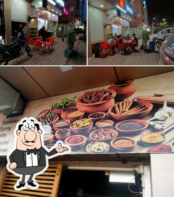 Take a seat at one of the tables at Jack's Grill Veg & Non Veg