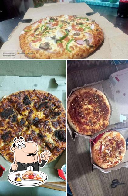 Get pizza at New Pizza King