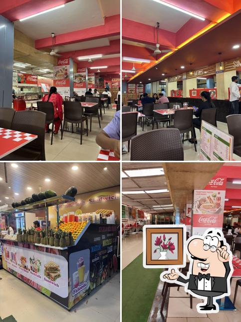 Take a seat at one of the tables at Neeta’s Sagar Inn