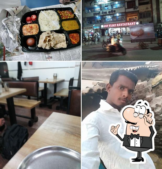 Take a seat at one of the tables at Jay Vijay Restaurant