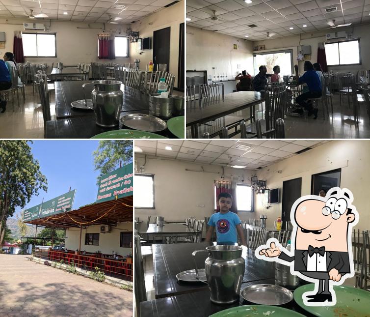 Take a seat at one of the tables at Vrindavan Restaurant